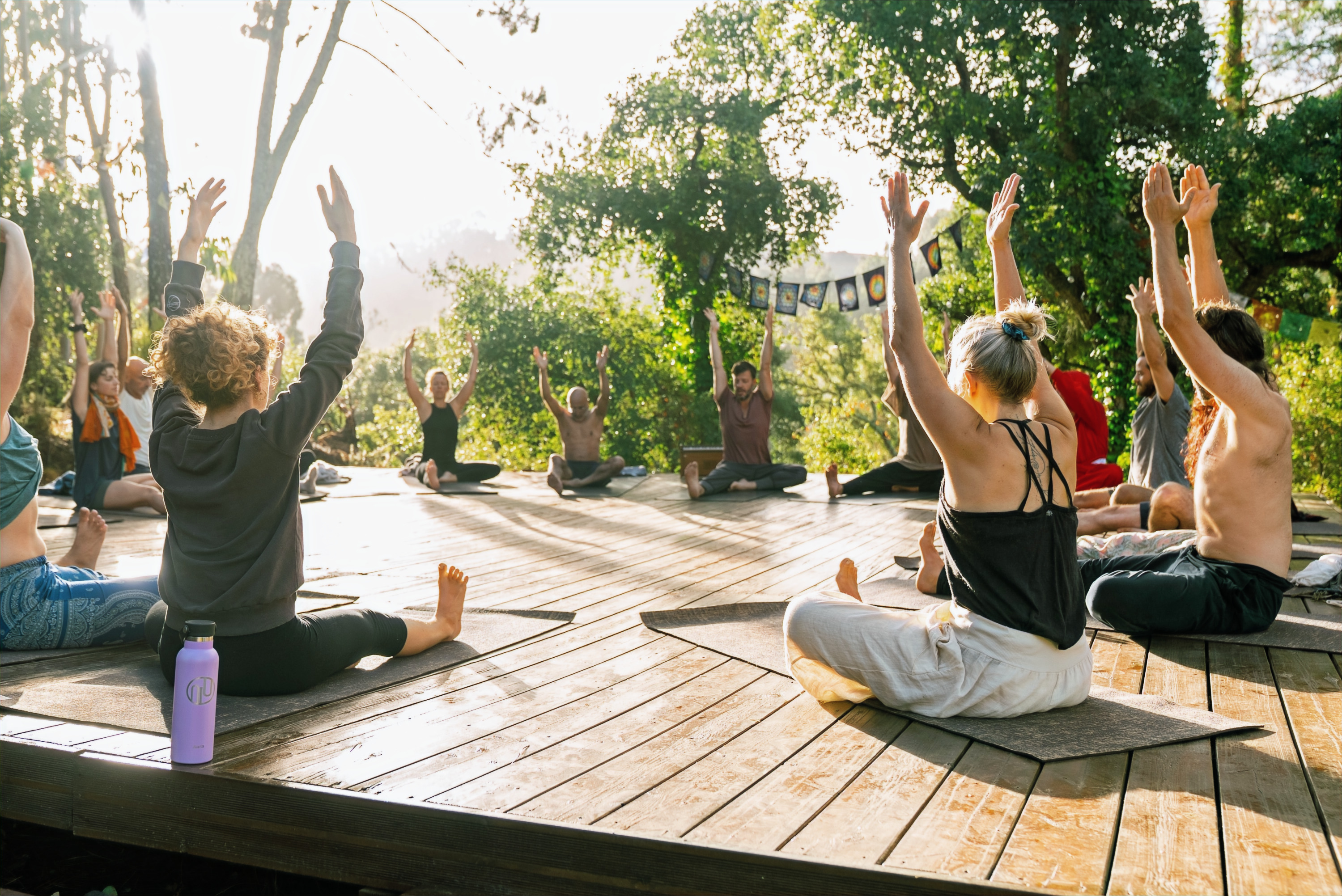Participants learning bodywork in an outdoor natural setting
